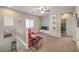 Upstairs loft area with plush carpeting, comfortable seating, and natural light at 9326 Noble Sage Ave, Las Vegas, NV 89148