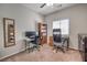 Functional home office with two desks, two chairs, and ample bookshelf storage for books and decor at 9326 Noble Sage Ave, Las Vegas, NV 89148
