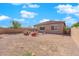 Spacious backyard with a blank canvas and block fence for privacy at 9590 Smiley Creek St, Las Vegas, NV 89178