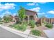 Beautiful home exterior featuring low maintenance landscaping and decorative brickwork on a sunny day at 9590 Smiley Creek St, Las Vegas, NV 89178