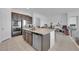 Spacious kitchen island with stainless steel appliances and a breakfast bar is great for entertaining at 9590 Smiley Creek St, Las Vegas, NV 89178