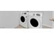 Functional laundry room featuring a side by side washer and dryer for convenience at 9590 Smiley Creek St, Las Vegas, NV 89178