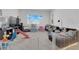 Bright and airy living room filled with lots of toys and fun places to play at 9590 Smiley Creek St, Las Vegas, NV 89178