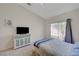 Comfortable bedroom with sliding glass door, vaulted ceilings, and plush carpeting at 9724 Canyon Walk Ave, Las Vegas, NV 89147