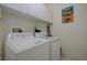 Bright laundry room with washer and dryer at 9724 Canyon Walk Ave, Las Vegas, NV 89147