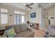 Cozy living area featuring wood floors, stylish furniture, and access to outdoor patio at 9724 Canyon Walk Ave, Las Vegas, NV 89147
