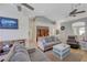 Spacious living area with ceiling fans, comfortable seating, and a view into the kitchen at 9724 Canyon Walk Ave, Las Vegas, NV 89147