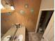 Bathroom with a single granite topped vanity, decorative wall art and tile flooring at , North Las Vegas, NV 89031