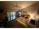 Bedroom featuring a ceiling fan, a sliding glass door, and a comfortable bed at , North Las Vegas, NV 89031