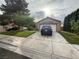 Charming single-story home featuring a well-maintained lawn and an attached two-car garage at , North Las Vegas, NV 89031