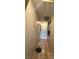 Hallway featuring a tiled floor, cabinets and various doors that lead to different rooms at , North Las Vegas, NV 89031