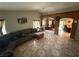 Living room featuring tile flooring and neutral decor, flowing into dining and kitchen areas at , North Las Vegas, NV 89031