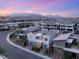 New residential construction showing multiple upscale homes in a planned community with mountain views at 10752 Patina Hills Ct, Las Vegas, NV 89135