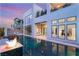 Backyard featuring a sleek pool, fire feature, and modern architectural design, perfect for upscale outdoor living at 10752 Patina Hills Ct, Las Vegas, NV 89135
