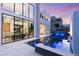 Stunning backyard with a modern pool, fire feature, and expansive windows offering breathtaking views at 10752 Patina Hills Ct, Las Vegas, NV 89135