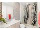 Stylish bathroom featuring a walk-in shower with designer tile, modern fixtures, and elegant vanity at 10752 Patina Hills Ct, Las Vegas, NV 89135
