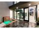 Open-air courtyard with water feature, modern staircase, and access to interior spaces, creating a serene transition at 10752 Patina Hills Ct, Las Vegas, NV 89135