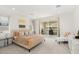 Bright main bedroom with neutral palette, leading to private outdoor patio with ample light at 10752 Patina Hills Ct, Las Vegas, NV 89135