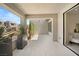 Covered outdoor patio featuring neutral colors, privacy, and modern design at 10752 Patina Hills Ct, Las Vegas, NV 89135