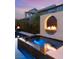 A modern outdoor pool with a raised spa and fire feature create an inviting and luxurious space at 10752 Patina Hills Ct, Las Vegas, NV 89135