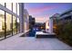 Expansive backyard with a sleek pool and spa, complemented by a modern fire feature and stylish patio at 10752 Patina Hills Ct, Las Vegas, NV 89135