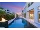 Relaxing backyard pool with a fire pit, featuring stylish patio furniture and a sleek, modern design at 10752 Patina Hills Ct, Las Vegas, NV 89135