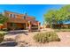 The backyard has desert landscaping, mature trees, and a patio with a BBQ area at 1091 Casa Palermo Cir, Henderson, NV 89011