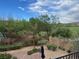 Well-maintained backyard features mature landscaping, desert scape and a view of the golf course at 1091 Casa Palermo Cir, Henderson, NV 89011