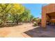 Desert landscaped backyard with patio area, outdoor furniture, and BBQ at 1091 Casa Palermo Cir, Henderson, NV 89011