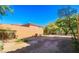 Large backyard features a perimeter block wall, natural landscaping, and mature shade trees at 1091 Casa Palermo Cir, Henderson, NV 89011