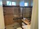 Tiled bathroom featuring large walk in shower and double windows at 1091 Casa Palermo Cir, Henderson, NV 89011