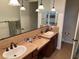 Spacious bathroom with double sinks, tile countertops and ample cabinet space at 1091 Casa Palermo Cir, Henderson, NV 89011