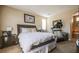Bedroom with a comfortable bed and access to a private bathroom featuring a soaking tub at 1091 Casa Palermo Cir, Henderson, NV 89011