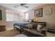 Comfortable bedroom featuring a large bed, couch, and decor to make this space feel like home at 1091 Casa Palermo Cir, Henderson, NV 89011