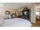 Bright and airy bedroom with a large dresser with mirror and an elliptical machine at 1091 Casa Palermo Cir, Henderson, NV 89011