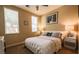 Neutral bedroom offers lots of natural light with two windows, soft carpet and white bedding at 1091 Casa Palermo Cir, Henderson, NV 89011