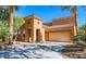 Inviting two-story home with a two-car garage, stylish stone accents, and well-manicured landscaping at 1091 Casa Palermo Cir, Henderson, NV 89011