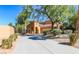 Inviting home with landscaped front yard and a driveway leading to a two-car garage at 1091 Casa Palermo Cir, Henderson, NV 89011