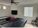 Recreation room with windows, television, game tables, and chair at 1091 Casa Palermo Cir, Henderson, NV 89011