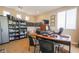 Spacious home office featuring a built-in bookshelf, comfortable seating, and a large desk perfect for productivity at 1091 Casa Palermo Cir, Henderson, NV 89011