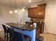 Eat-in kitchen with granite countertops, bar stool seating, and stainless steel appliances at 1091 Casa Palermo Cir, Henderson, NV 89011