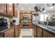 Well-equipped kitchen featuring dark wood cabinets, stainless appliances, and ample counter space at 1091 Casa Palermo Cir, Henderson, NV 89011