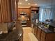 Well-equipped kitchen featuring granite countertops, stainless steel appliances, and wood cabinetry at 1091 Casa Palermo Cir, Henderson, NV 89011