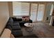 Cozy living room featuring a comfortable couch, area rug, and natural light at 1091 Casa Palermo Cir, Henderson, NV 89011