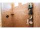 Shower boasts tile walls with a convenient corner shelf and a modern caddy for toiletries and accessories at 1091 Casa Palermo Cir, Henderson, NV 89011