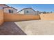 Large backyard with ample space and block wall, ready for landscaping at 10933 Sageview Ave, Las Vegas, NV 89166