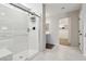 Modern bathroom showcasing a tiled shower with glass doors and convenient built-in shelving at 10933 Sageview Ave, Las Vegas, NV 89166