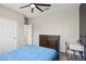 Relaxing bedroom features neutral walls, ceiling fan, desk area and convenient double door access at 10933 Sageview Ave, Las Vegas, NV 89166