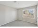 Comfortable bedroom features a window for natural light and neutral decor at 10933 Sageview Ave, Las Vegas, NV 89166