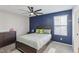 Inviting bedroom with accent wall, ceiling fan, and natural light at 10933 Sageview Ave, Las Vegas, NV 89166